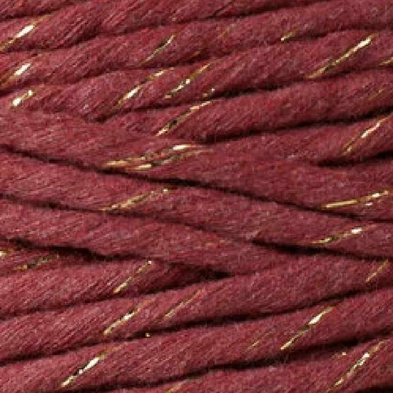 Close-up of red cord with gold metallic threads